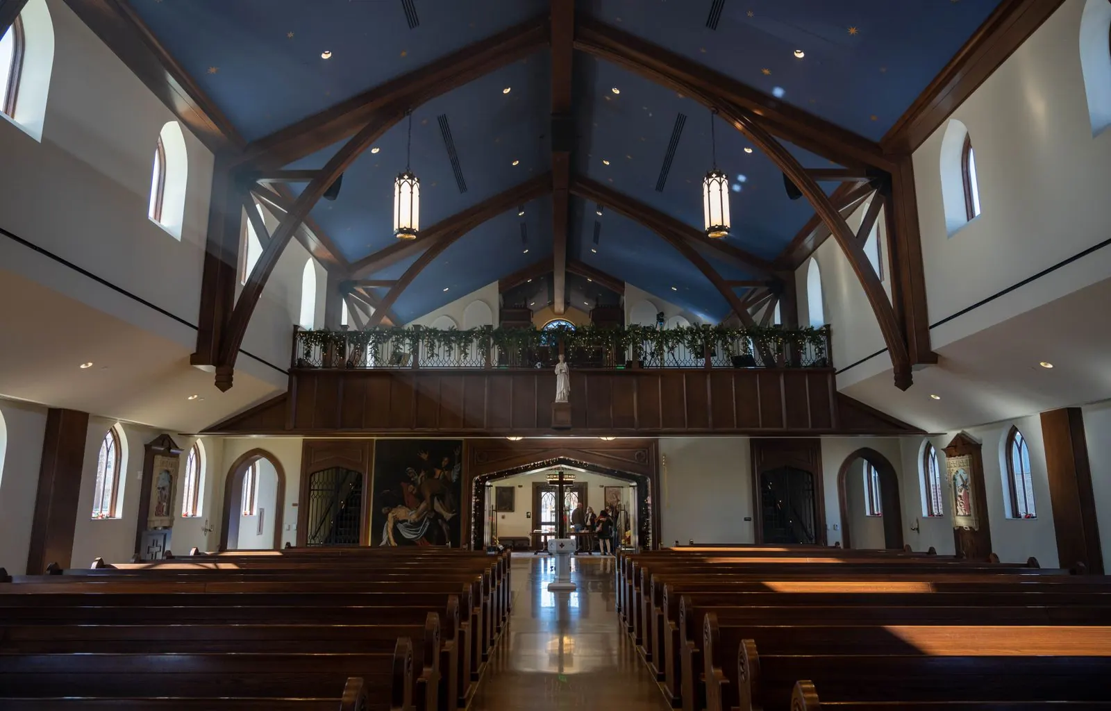 Spotless church sanctuary with polished pews and vacuumed aisle carpet